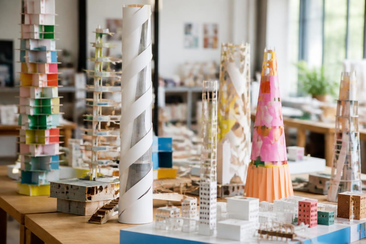 Detailed cardboard and timber architectural models made by students.